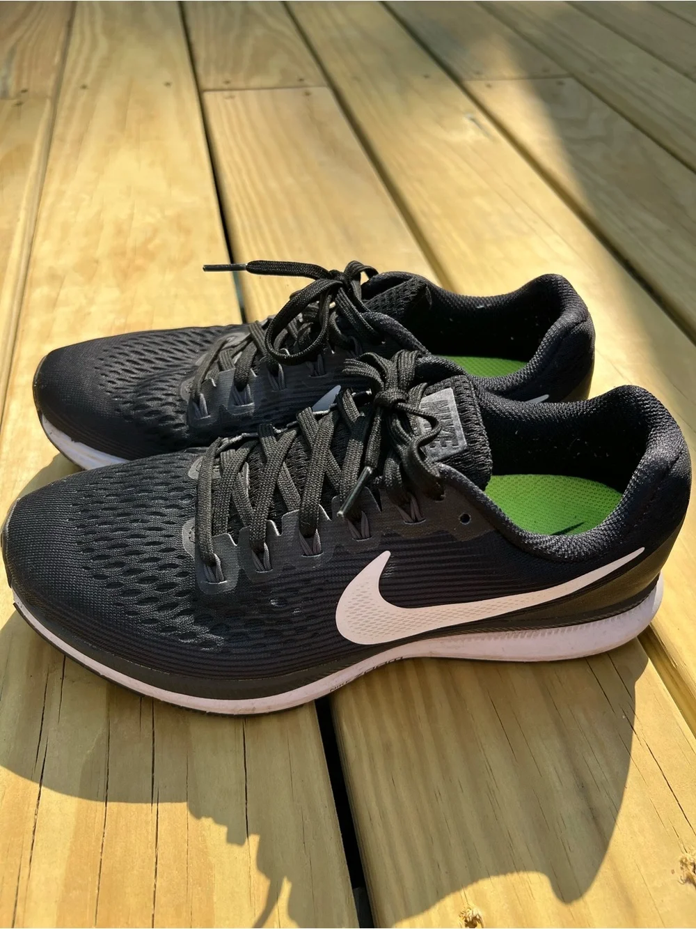 Nike Women’s Black Athletic Running Shoes with White Swoosh. Zoom Pegasus 34